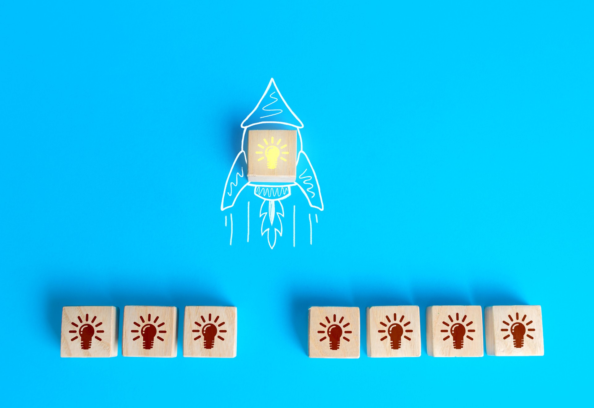 Block with the idea light bulb took off on an imaginary rocket doodle. Developing startup. Choosing best idea. Success investment. Business accelerator. Optimal solution. Creativity